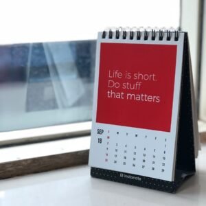 spiral freestanding calendar on white surface